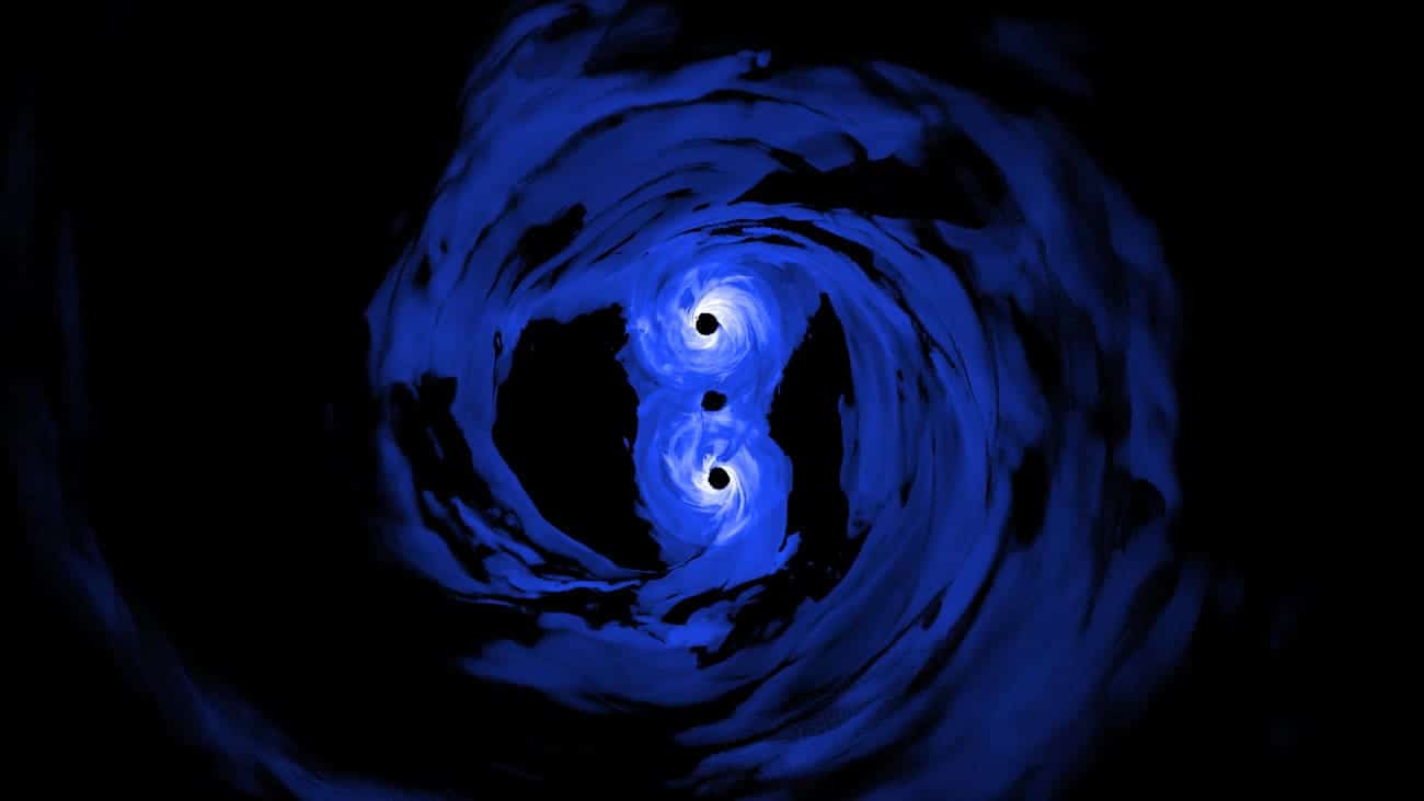 Взаимодействие сверхмассивных черных дыр в представлении художника / © NASA